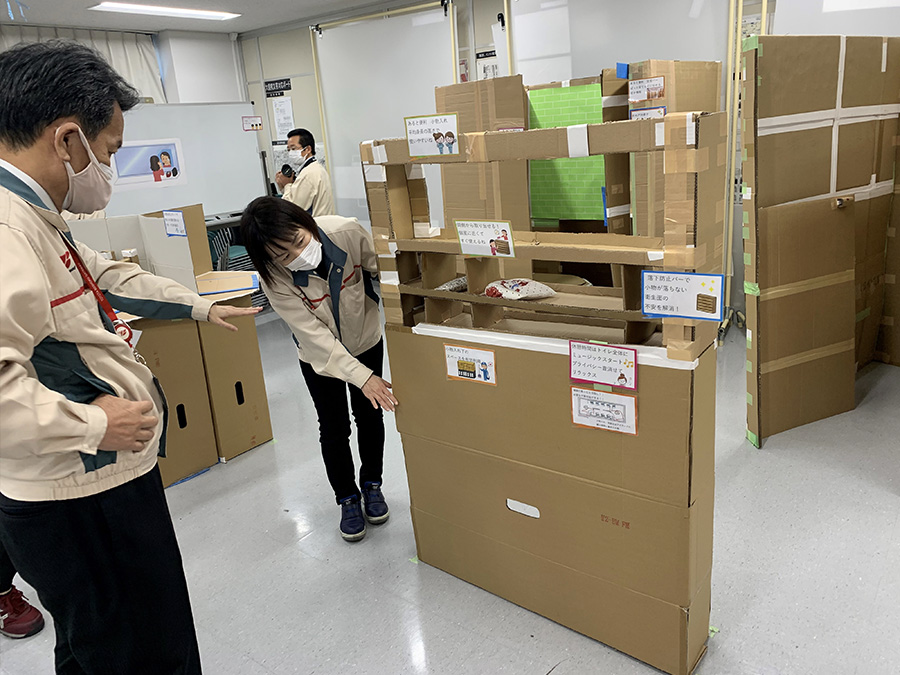 Photo:Considering how to improve the restroom, using a cardboard model